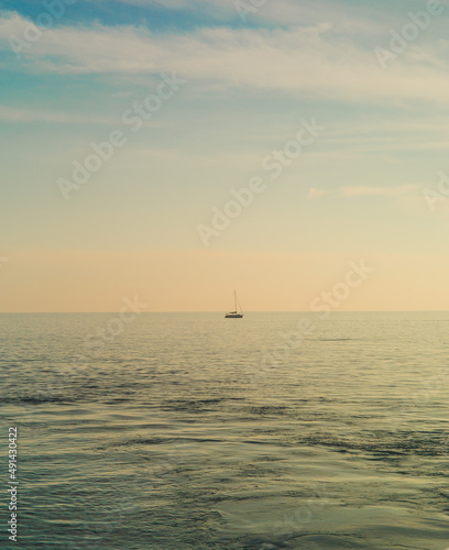 Meditteranean coastline with sailboat, Italian seaside, French seaside