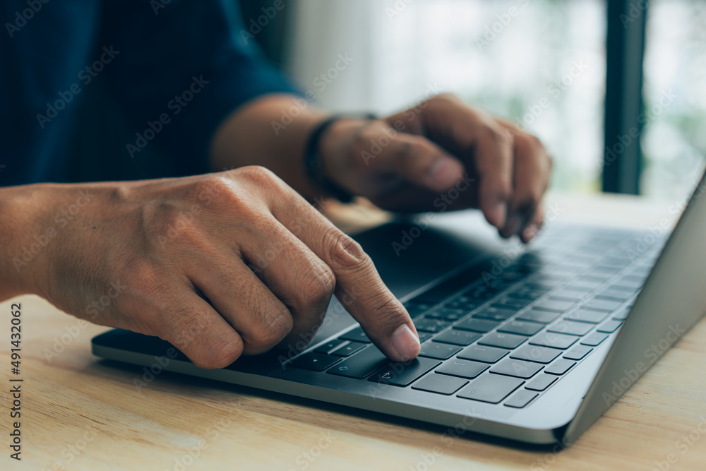 closeup hands of businessman working at office, Man typing keyboard on laptop or computer closeup hands of businessman working at office, Man typing keyboard on laptop or computer
