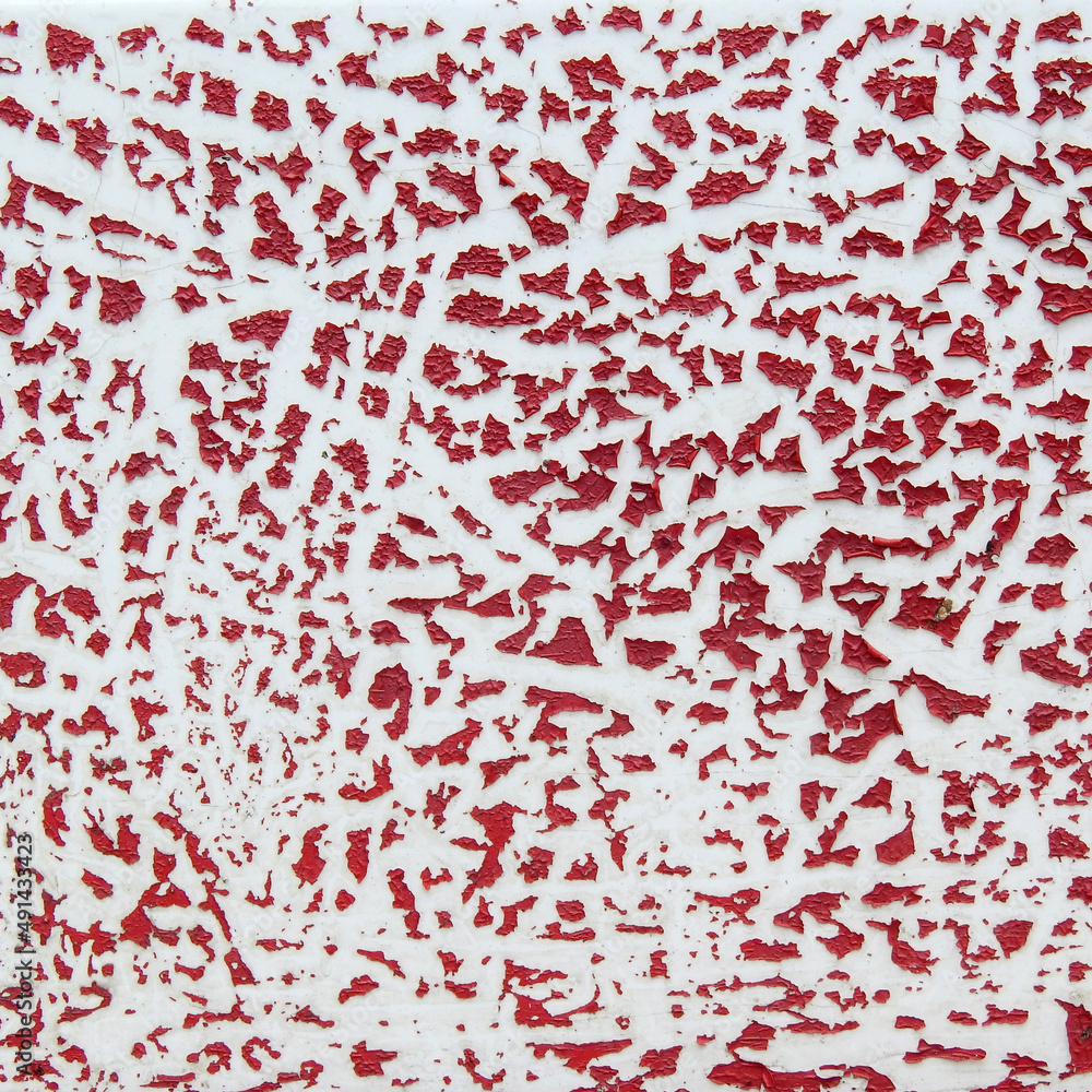 crack of dry red color peeling on white wall texture crack of dry red color peeling on white wall texture