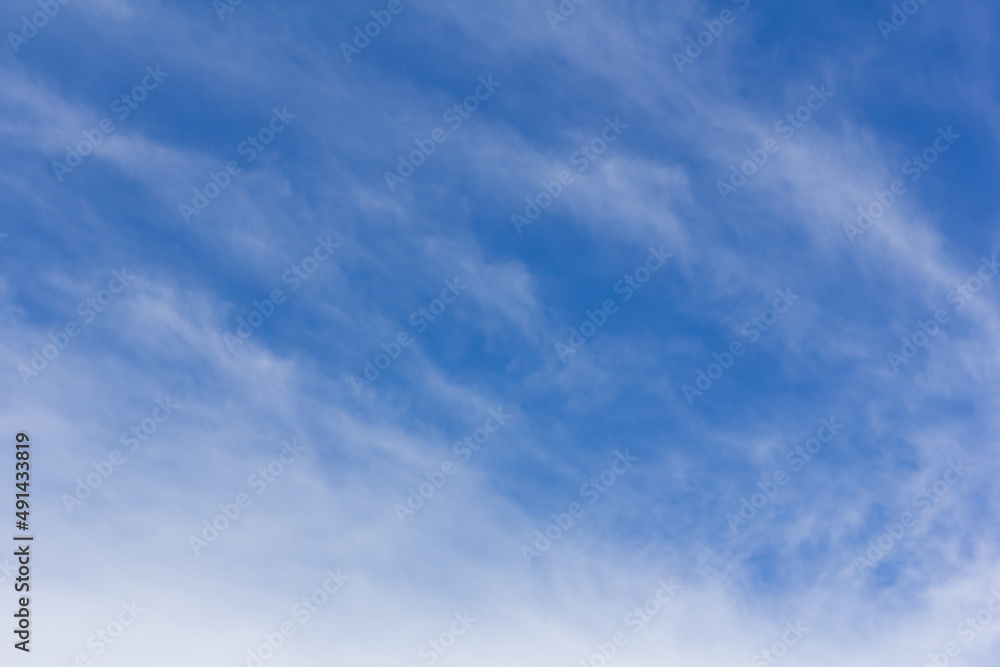 white fluffy clouds in the blue sky, nature background white fluffy clouds in the blue sky, nature background