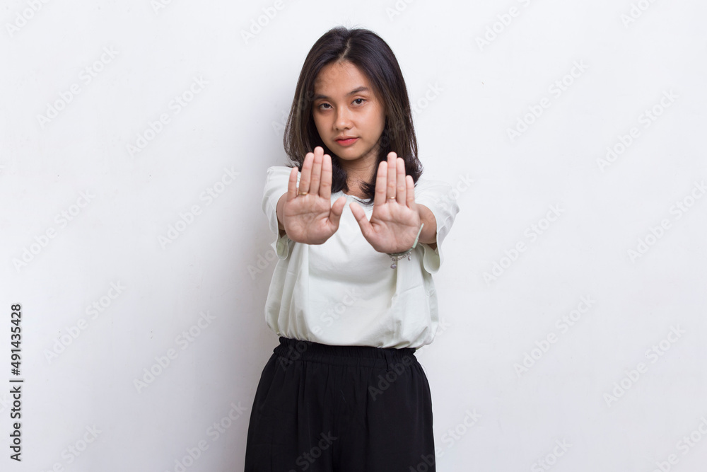 beautiful young woman with open hand doing stop sign with serious expression defense gesture isolated on white background
beautiful young woman with open hand doing stop sign with serious expression defense gesture isolated on white background