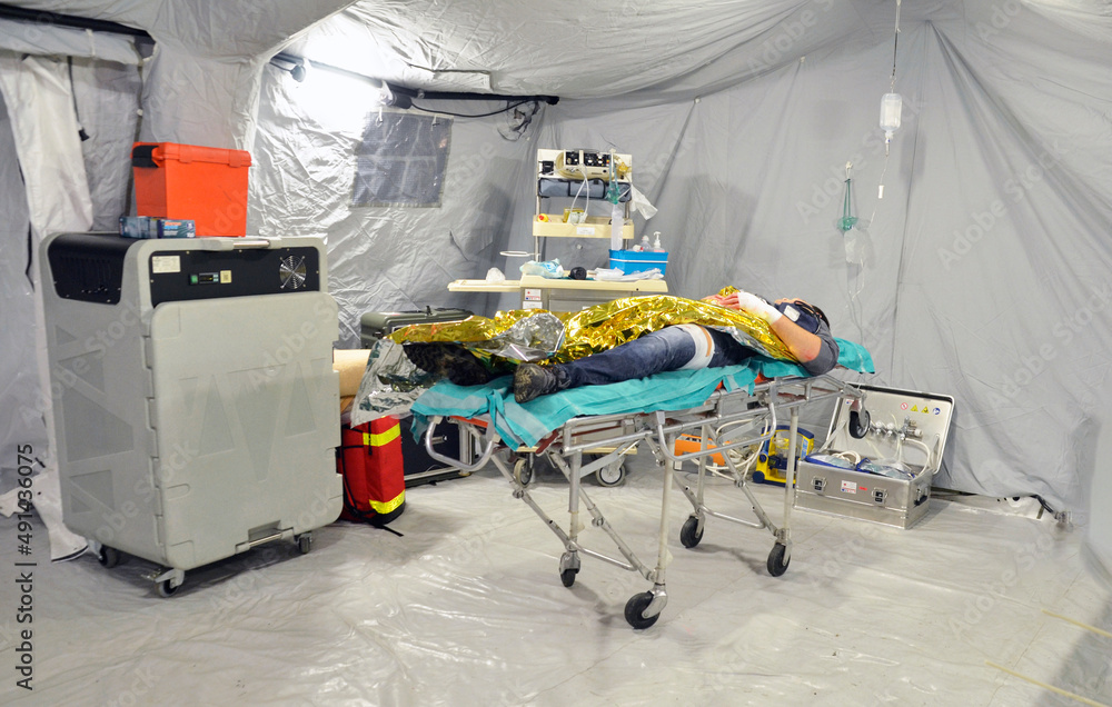 First aid tents Triage Person injured while fleeing from Ukraine. Red