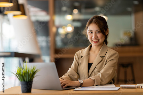 Portrait of a business woman smiling and looking at the camera.