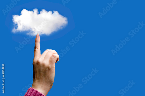 finger holding or touching a cloud, data storage cloud computing concept