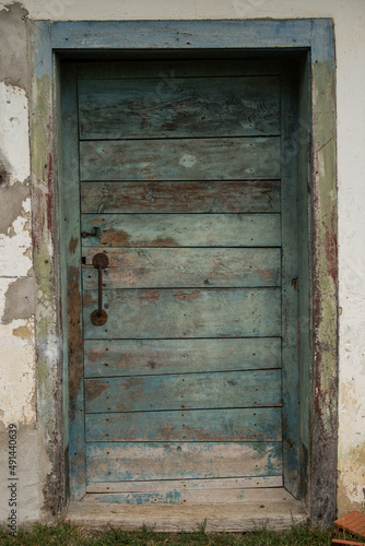 Sunja, Croatia, 05,04,2021: Old wooden rustic doors on rural home wall.