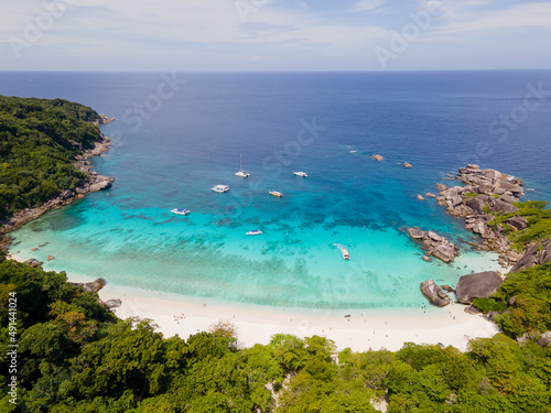 Fototapeta Naklejka Na Ścianę i Meble -  Top and aerial view of beach of one island in Similan Islands of Thailand during daylight with sunny sky and some cloud blue sky and emerald water.