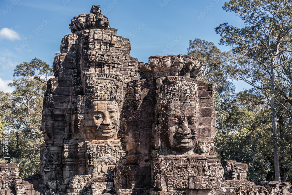 Fototapeta premium The sacred faces of ancient kings of Cambodia in Bayon temple of Angkor complex, Siem Reap, Cambodia