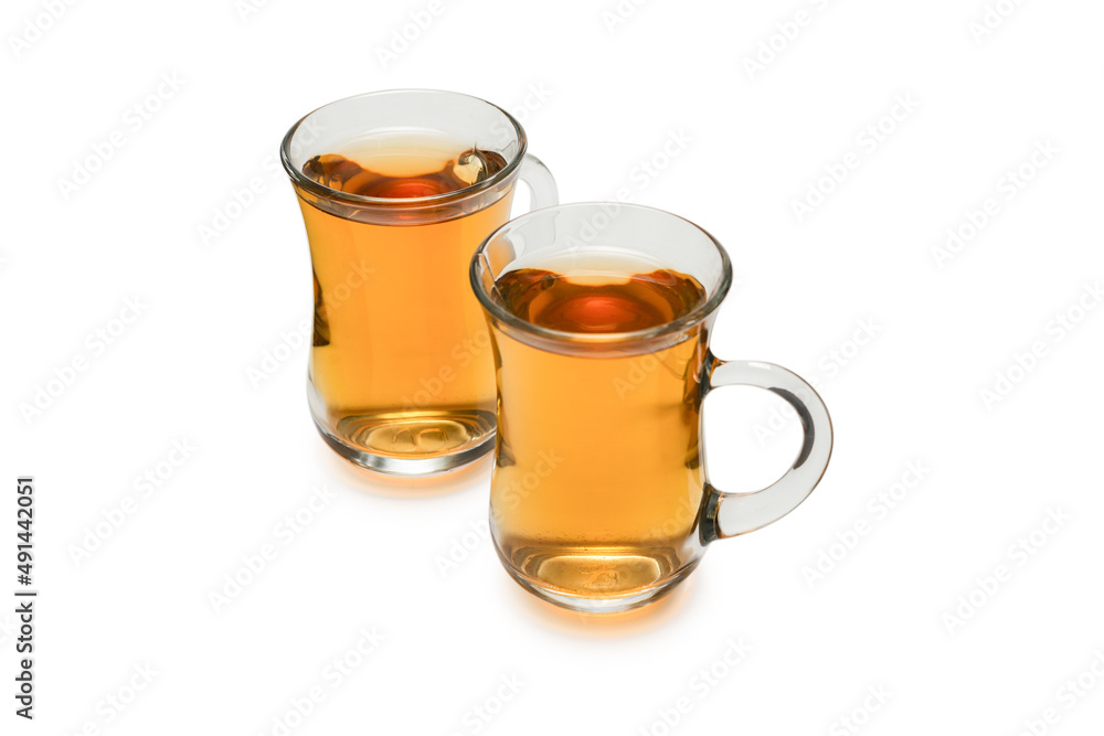 A turkish glass of tea isolated on white background. A turkish glass of tea isolated on white background.