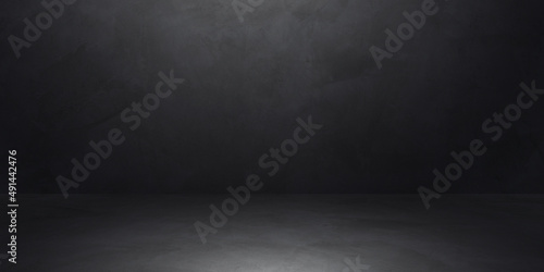 Dark cement wall room studio background rough floor with soft light well editing montage display products and text present on empty free space backdrop