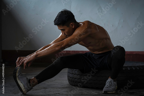 Fitness man exercise training warm up body and posing in gym,Healthy lifestyle.
