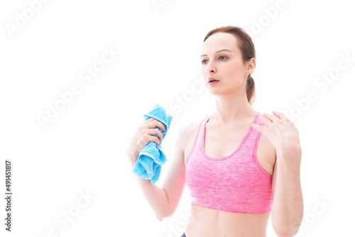 汗を拭くスポーツウェアを着た若い女性 © maroke