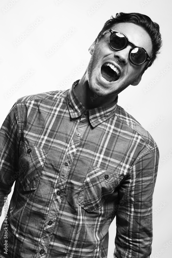 emotional portrait of a young attractive man of athletic build in sunglasses emotional portrait of a young attractive man of athletic build in sunglasses