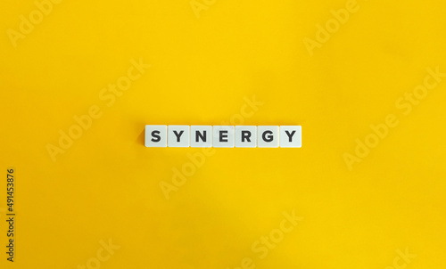 Synergy Buzzword and Banner. Letter Tiles on Yellow Background. Minimal Aesthetics.