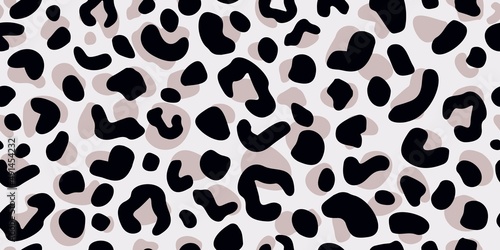 Leopard skin seamless pattern on gray background. Retro savannah animals in engraving style.