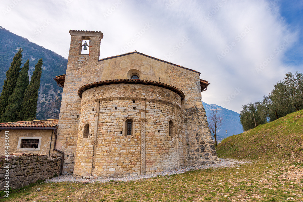 Small ancient church of San Lorenzo Martire (St. Lawrence Martyr) in Romanesque Gothic style, XII century. Tenno village, Trento province, Trentino Alto Adige, Italy, Europe.