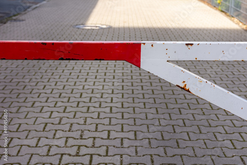 a barrier in red and white on a street