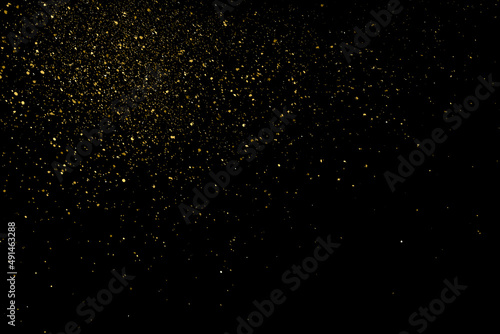 Gold Glitter Texture Isolated on Black Background. Golden stardust. Amber Particles Color. Sparkles Rain. Vector Illustration, Eps 10.