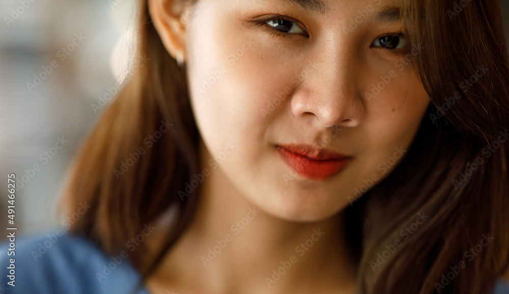 Portrait of Asian Woman smiling with perfect smile and looking at camera Portrait of Asian Woman smiling with perfect smile and looking at camera