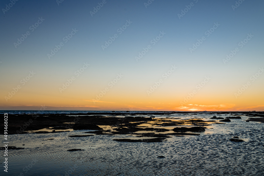 Scenic sunset sky over wavy sea in Spain Scenic sunset sky over wavy sea in Spain