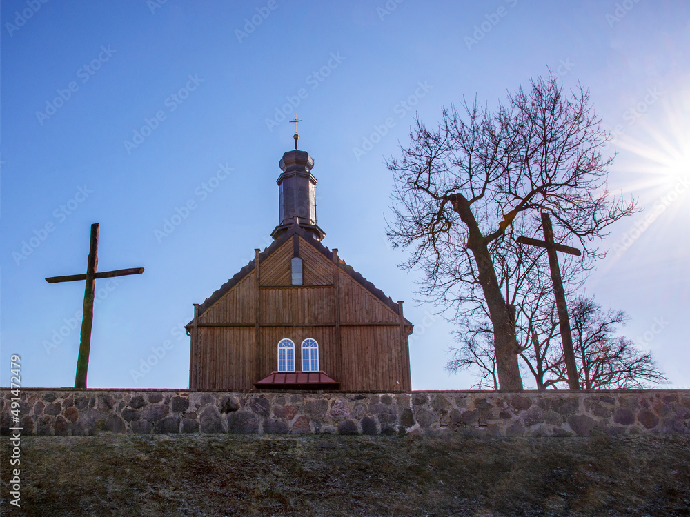 Built in 1696 from wood, the religious complex consists of a belfry and the Catholic church of St. Dorothy in the village of Winna-Poświętna in Podlasie, Poland. Built in 1696 from wood, the religious complex consists of a belfry and the Catholic church of St. Dorothy in the village of Winna-Poświętna in Podlasie, Poland.