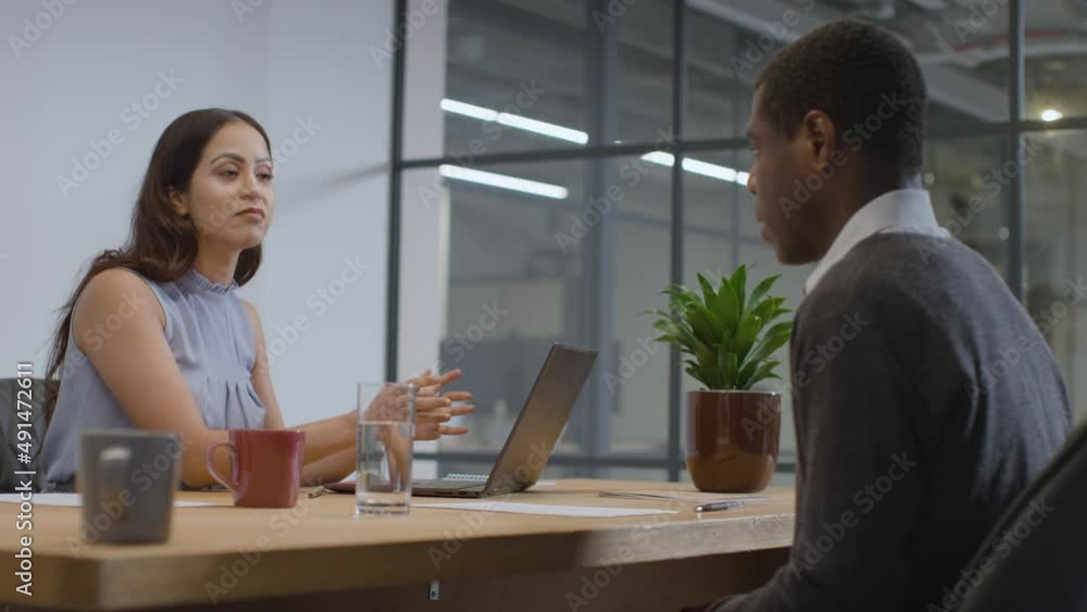 Mid Shot of Woman and Man Talking in Meeting Mid Shot of Woman and Man Talking in Meeting