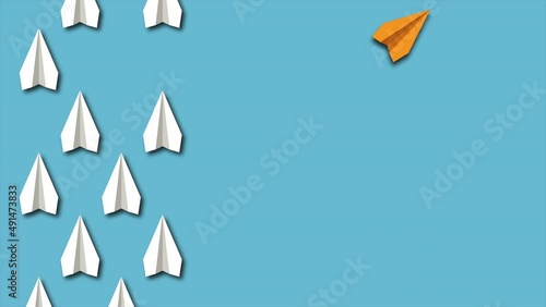 Think differently concept. Yellow paper plane changes direction. Blue background.