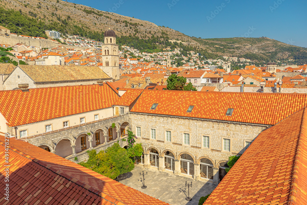 panorama of Dubrovnik cityscape from the top of the old medieval walls in Croatia. Dubrovnik historic UNESCO city of Dalmatia in Croatia. Bell tower of Franciscan Church Monastery and Crkva sv. Spas panorama of Dubrovnik cityscape from the top of the old medieval walls in Croatia. Dubrovnik historic UNESCO city of Dalmatia in Croatia. Bell tower of Franciscan Church Monastery and Crkva sv. Spas