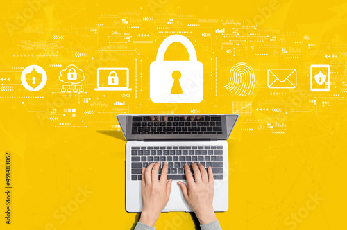 Internet network security concept with person using a laptop computer photo