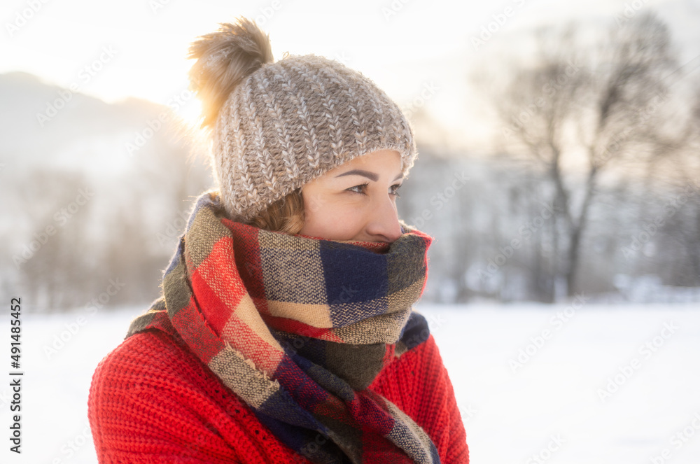 Winter portrait outdoor beautiful woman wearing woolen sweater hat and scarf Winter portrait outdoor beautiful woman wearing woolen sweater hat and scarf