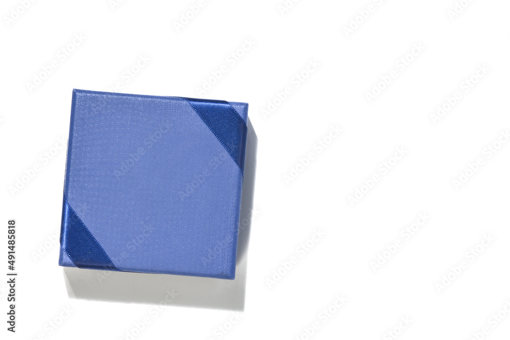 Overhead shot of blue color gift wrap on white background Overhead shot of blue color gift wrap on white background