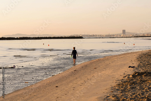 la lunga spiaggia di Rimini nellaluce dorata dell'alba photo