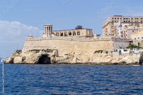 The Siege Bell Memorial and Terraced Arches on the Lower Barrakka Gardens, both built on the remains of the Saint Christopher Bastion overlooking the Grand Harbour - Valletta, Malta.
