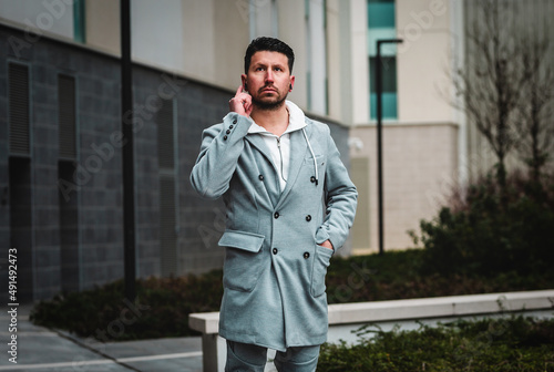 Wallpaper Mural Businessman with mobile phone and bluetooth headset. Torontodigital.ca