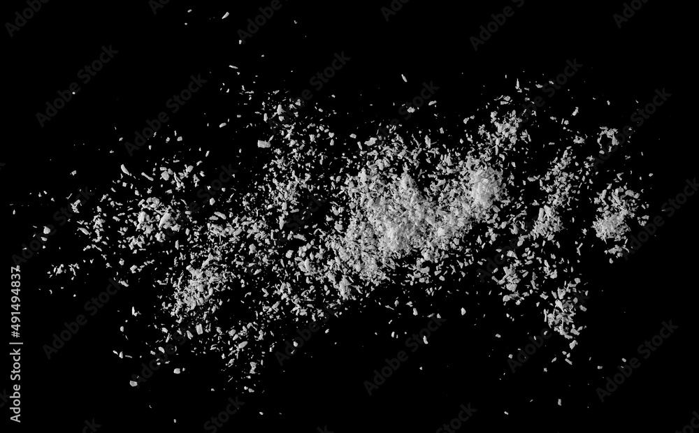Pile of shredded coconut meat isolated on black, top view