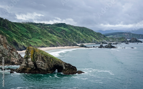 panorama of white sand beach with big rocks on the coast of Galicia