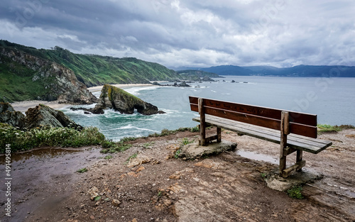 bench to sit next to the cliffs of the coast of Galicia photo
