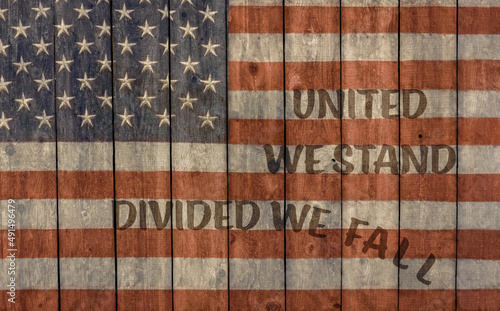 Slika na platnu Vintage American flag United we stand divided we fall painted on old barn wall