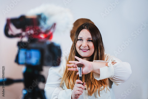 Beauty blogger recording a vlog on makeup