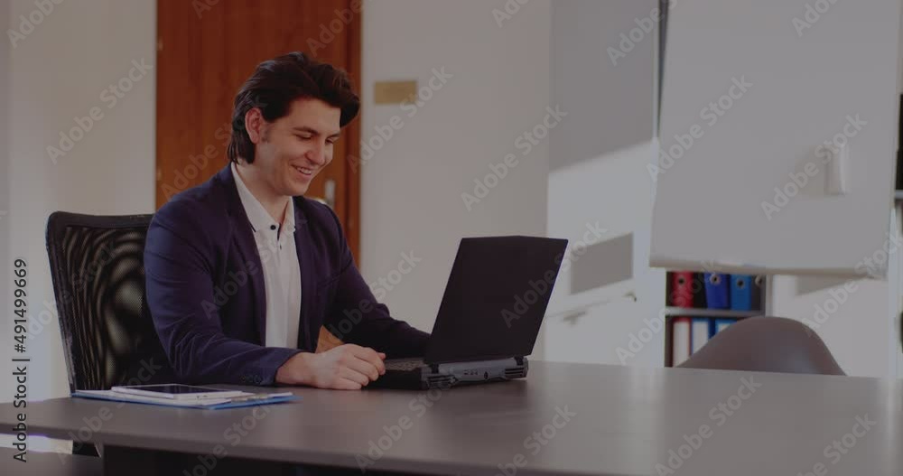 Businessman discussing on video call at workplace Businessman discussing on video call at workplace