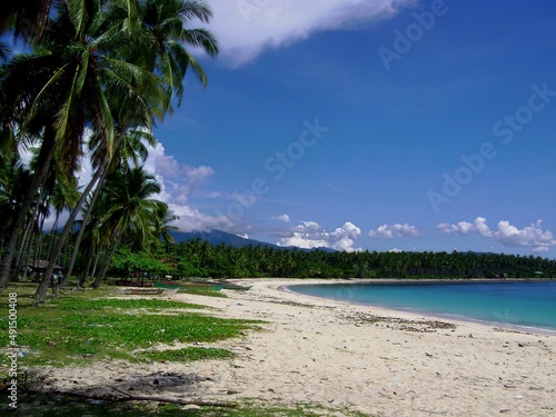 Beautiful stretch of white sand beaches and pristine blue waters of Dahican Beach, Davao Oriental, Philippines.