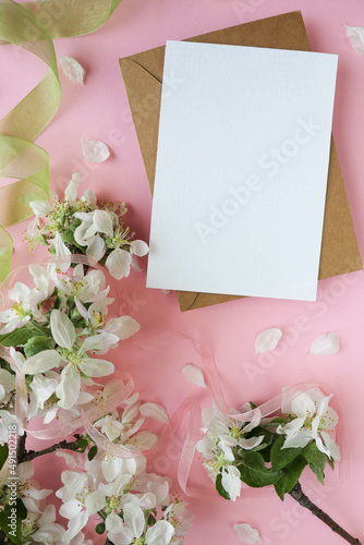 postcard mockup. Frame from flowering spring branches and white blank for the text. congratulation. invitation