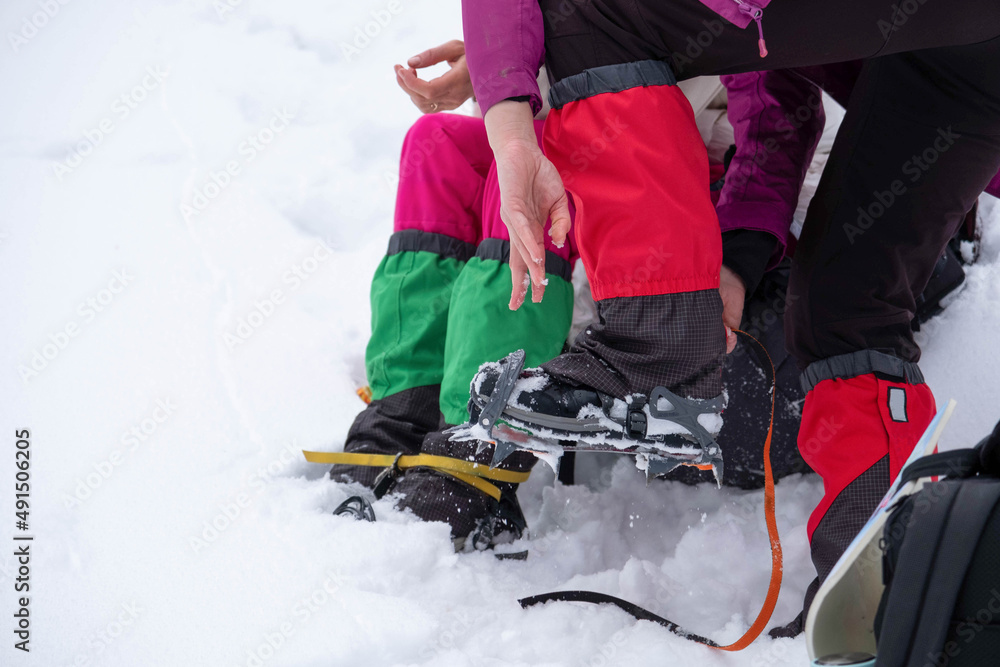 Naklejka premium Mountain hiking gear being put on by a hiker