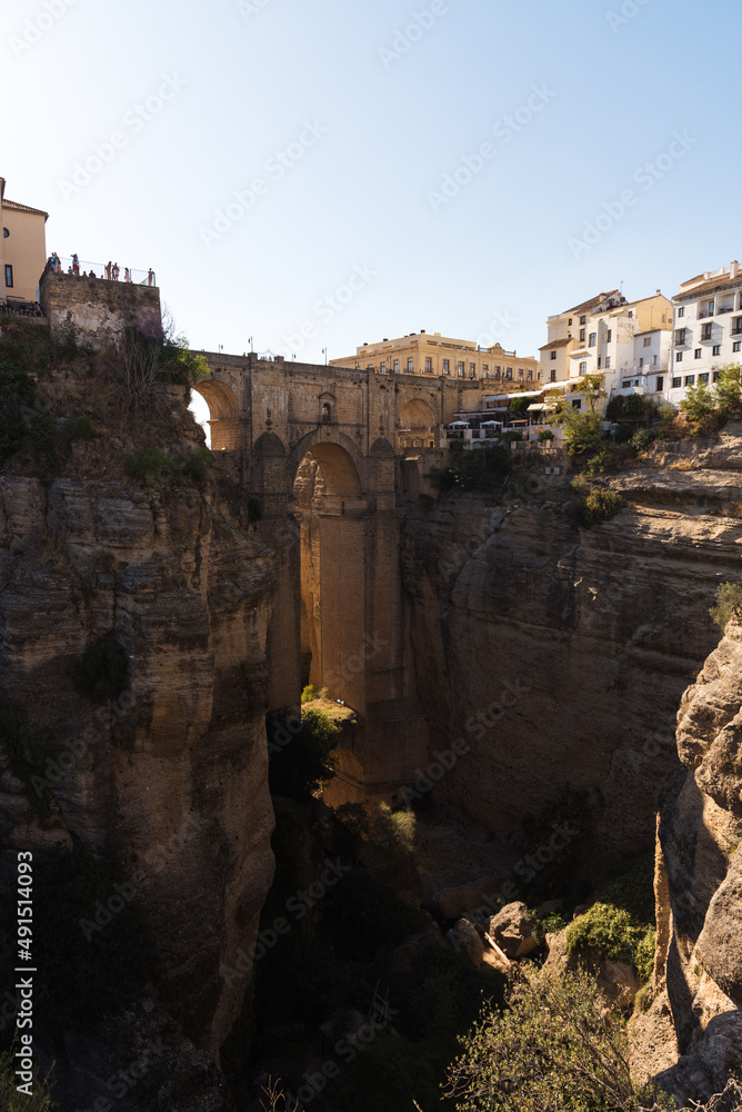 Puente Nuevo (New bridge) crossing El Tajo gorge in the famous white village of Ronda at daylight, Malaga province, Andalusia, Spain