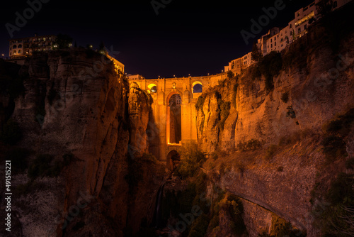 Scenic view of Puente Nuevo (New bridge) over El Tajo gorge in the famous white village of Ronda at night, Malaga province, Andalusia, Spain