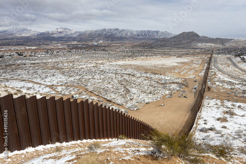 Snowy landscape of the wall that divides Mexico from the United States in Ciudad Juárez, border with El Paso, Texas. photo