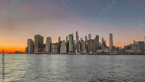 Panoramic view of Manhattan skyline during a beautiful sunset on a cold winter evening in New York City. © Rajesh