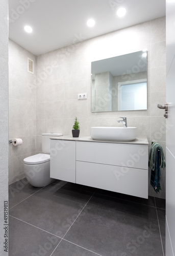 White bathroom with dark gray floor