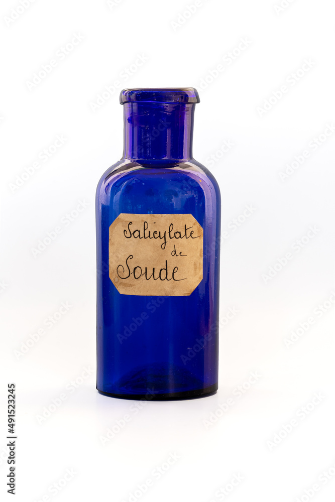 ancient apothecary blue jar with a label where it is written ancient apothecary blue jar with a label where it is written