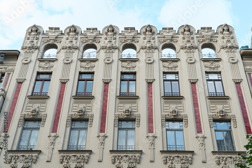 The facade of the Jugendstil building - an outstanding example of Art Nouveau architecture located in the quarter of the historical center of Riga in Latvia on Albert street.