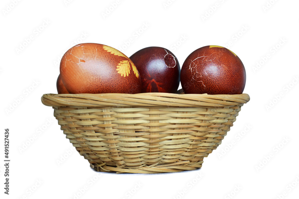 Easter basket full of cracked Easter eggs isolated on white background Easter basket full of cracked Easter eggs isolated on white background